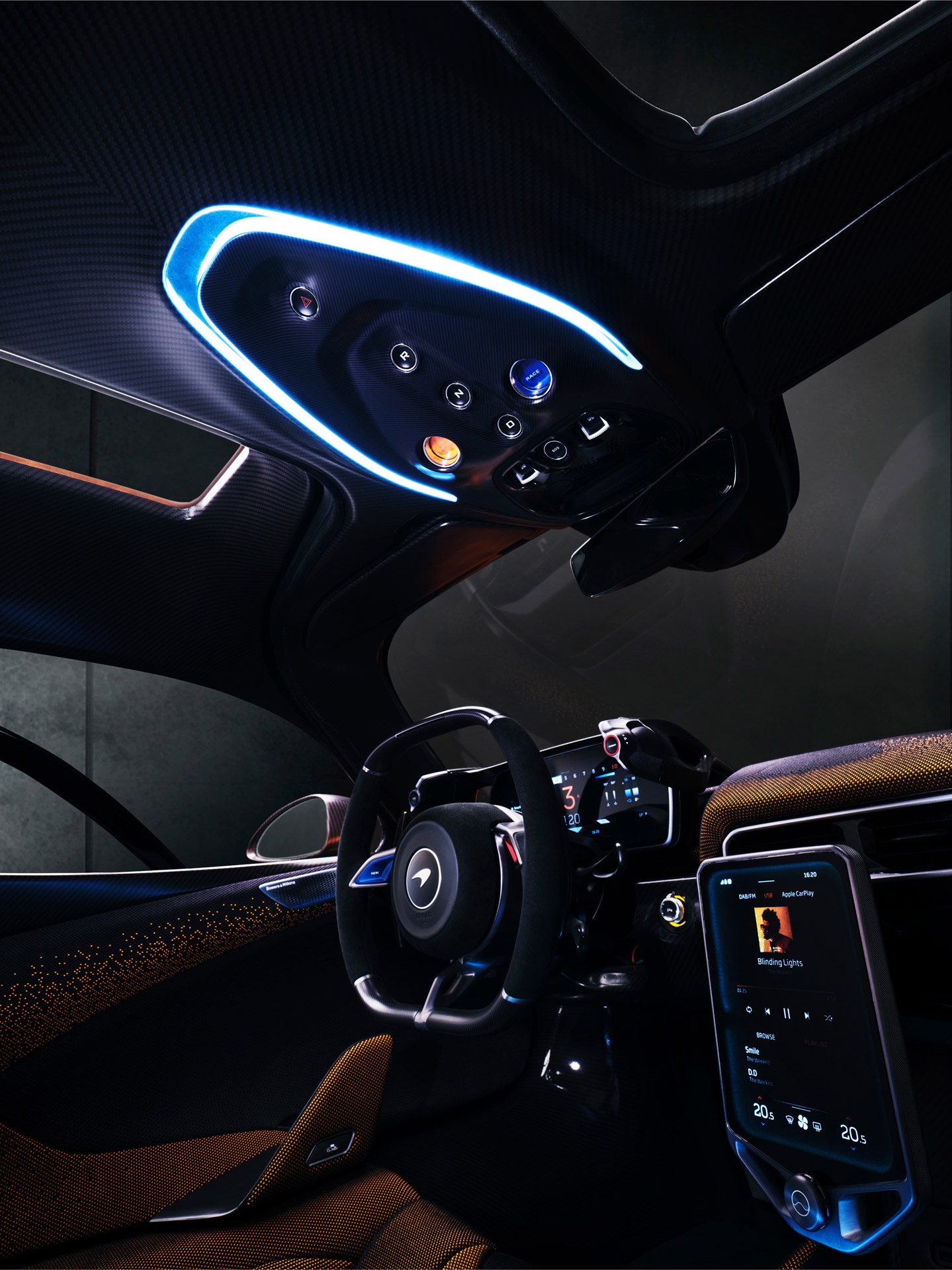 A close-up view of the McLaren W1's advanced interior cabin, showing the minimalist cockpit design and glowing digital displays.