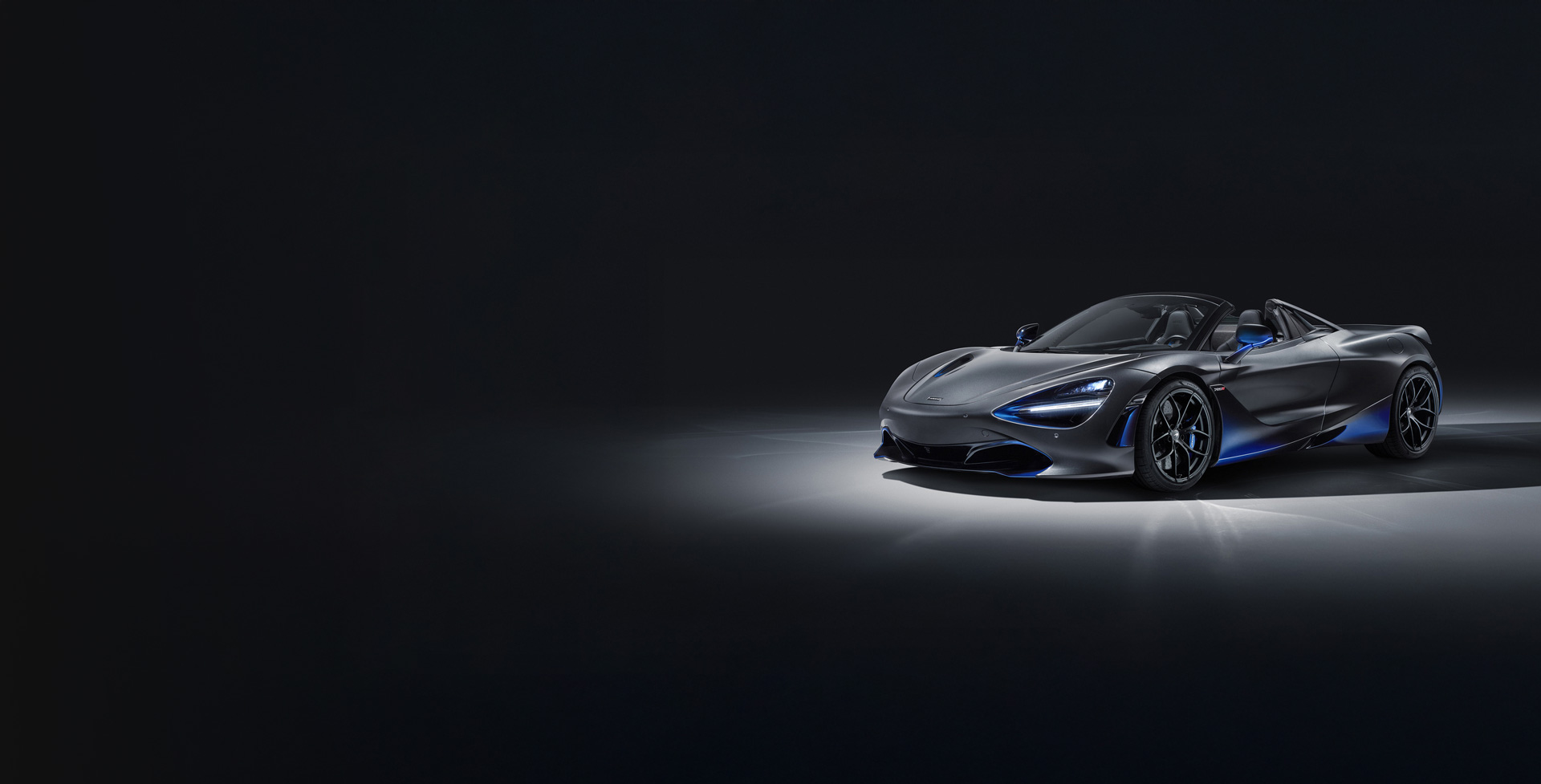 Graphite Mclaren 720S Spider with custom blue details.
