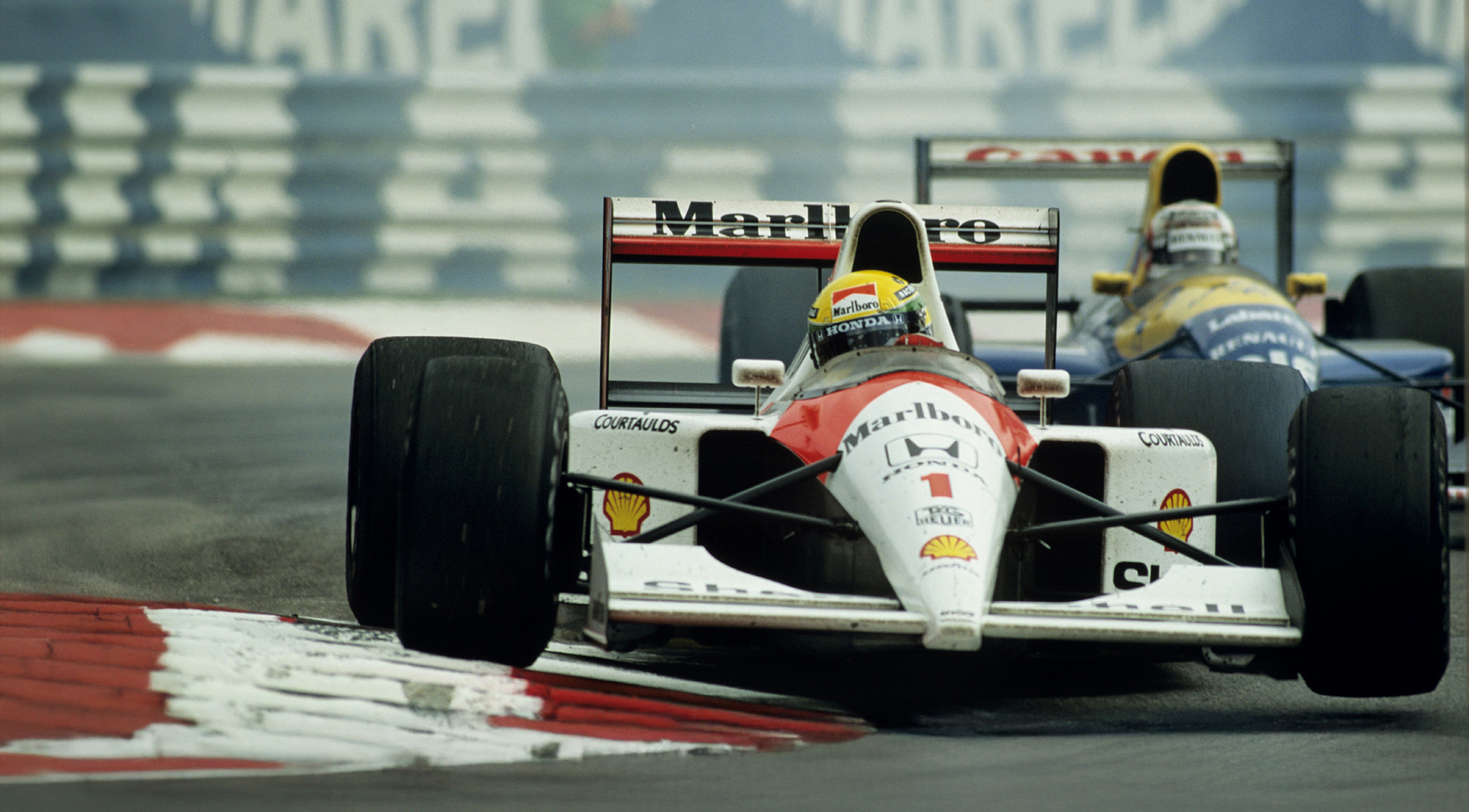 Ayrton Senna racing in a Formula 1 race.