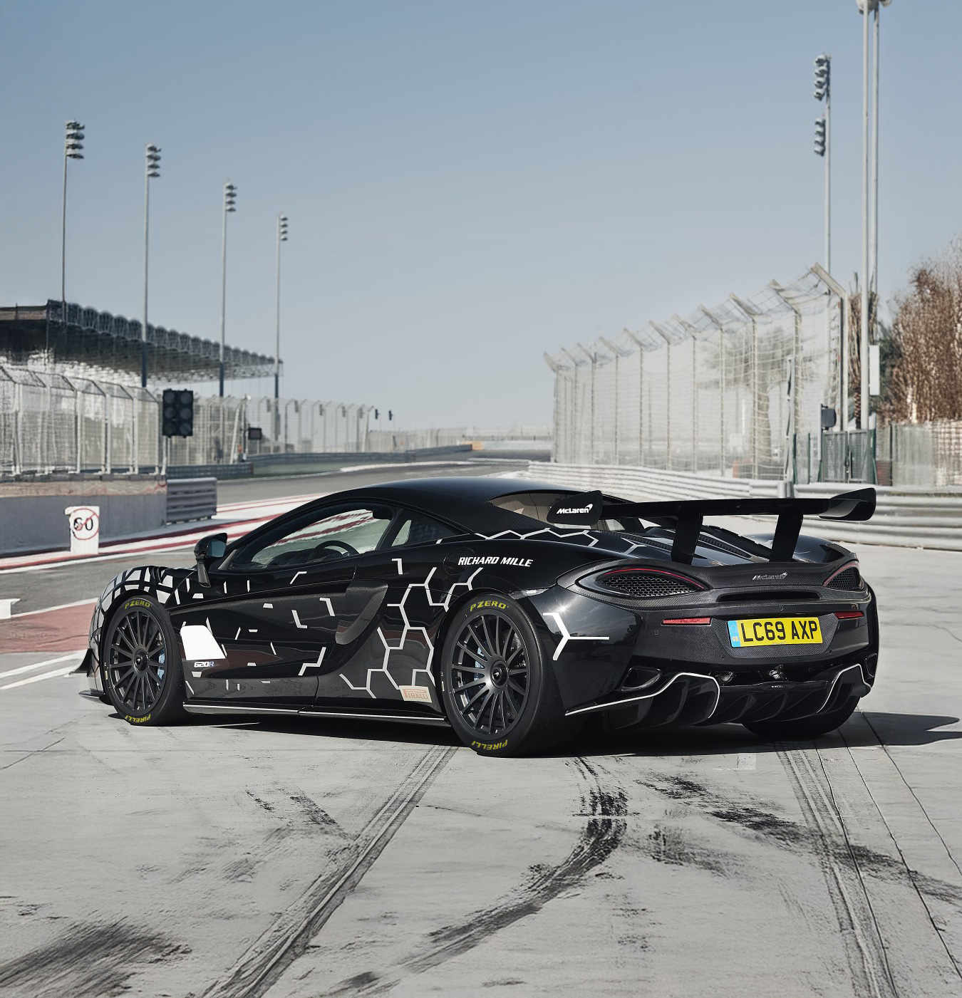 McLaren 620R parked across the pit exit of a race track.