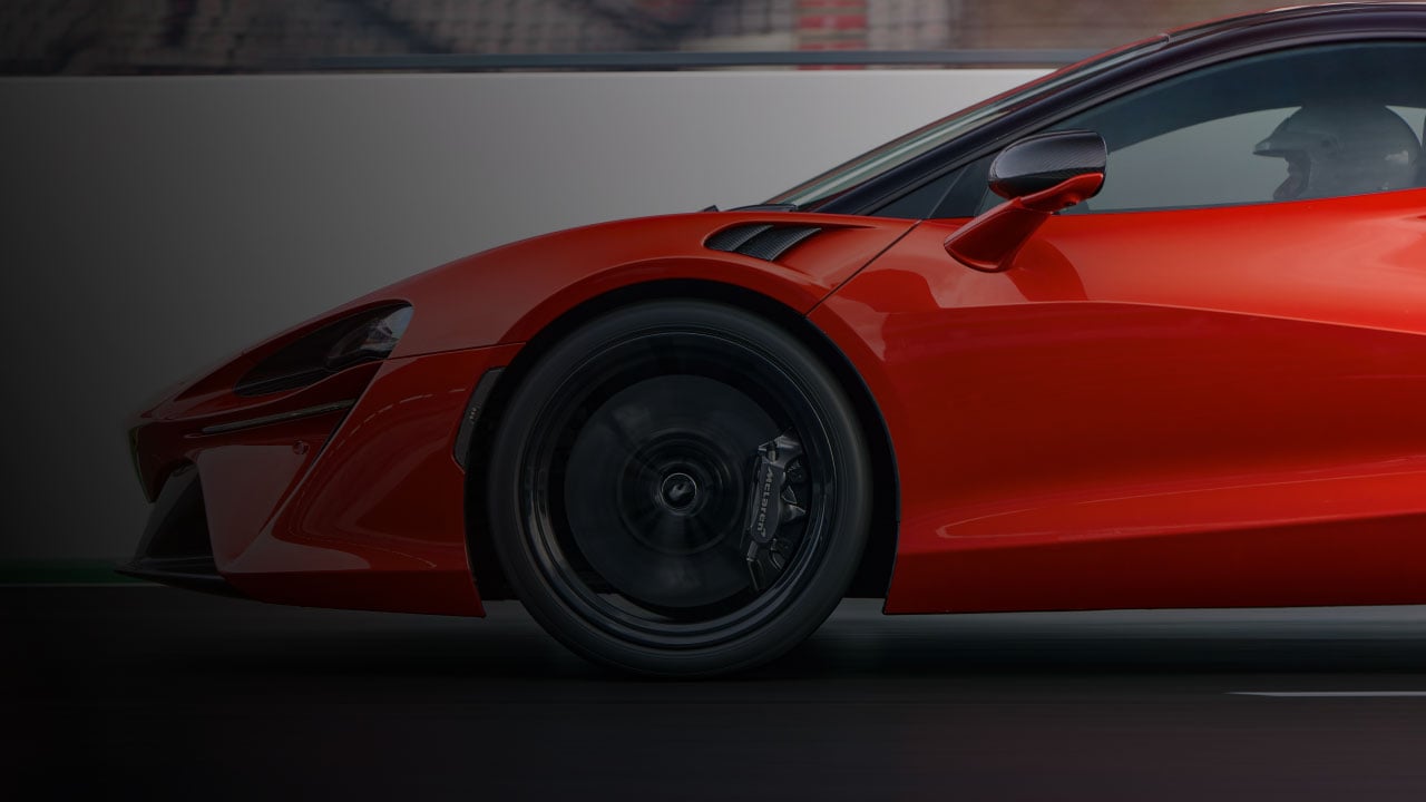 Portrait of red 750S on track.