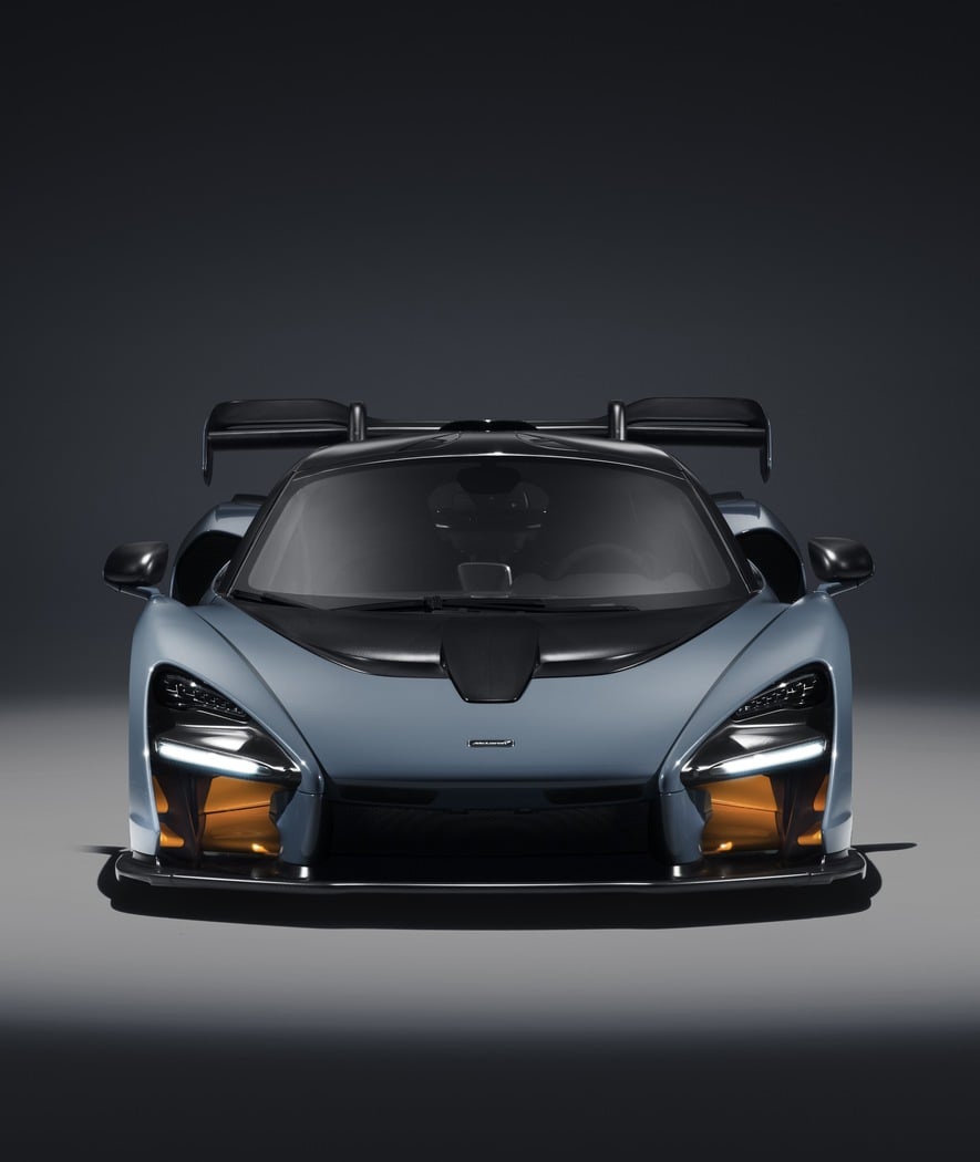 The McLaren Senna showcased in a front-on studio shot, highlighting its extreme aerodynamic bodywork and aggressive design.