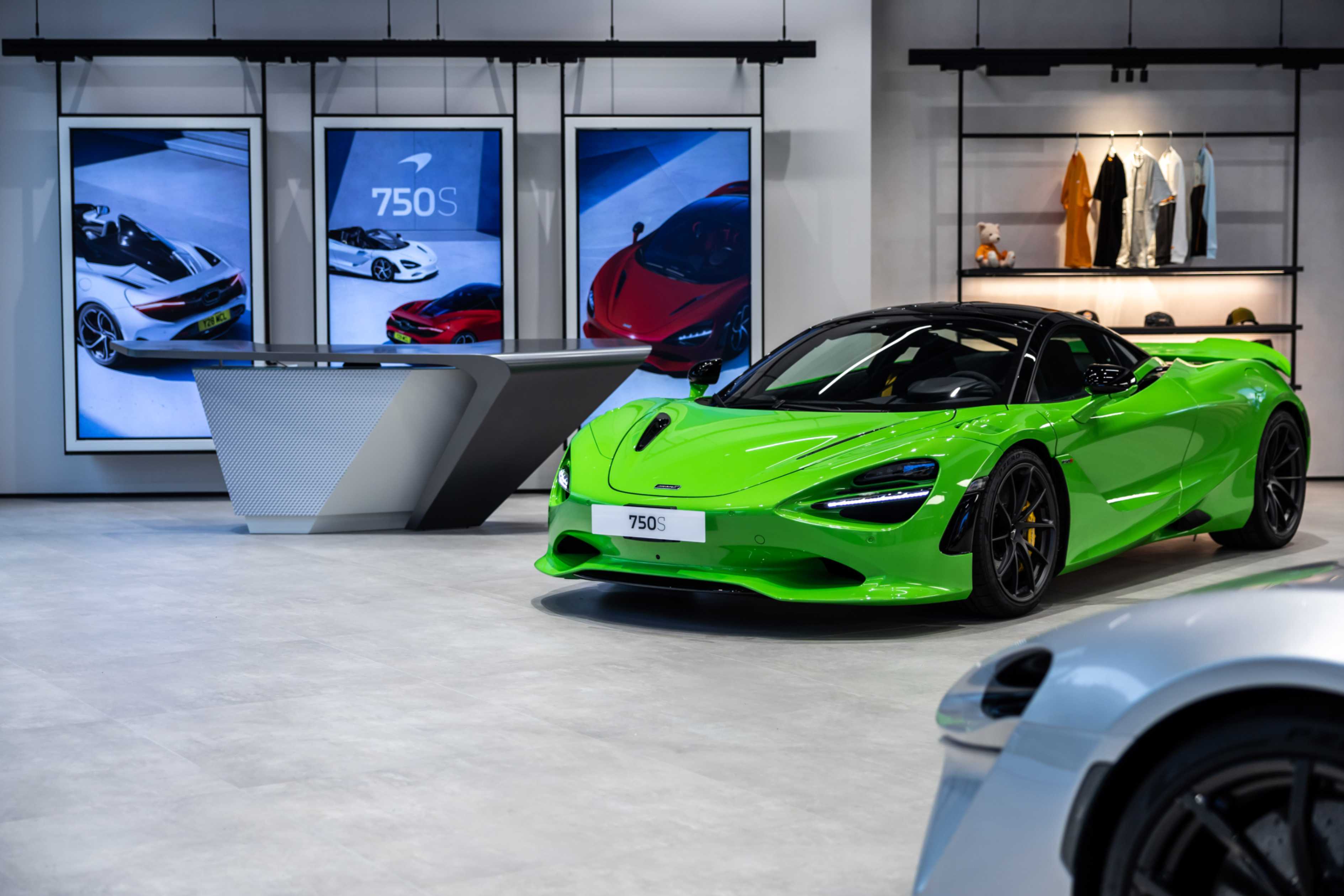 A bright green McLaren 750S on display inside the McLaren Taichung showroom.