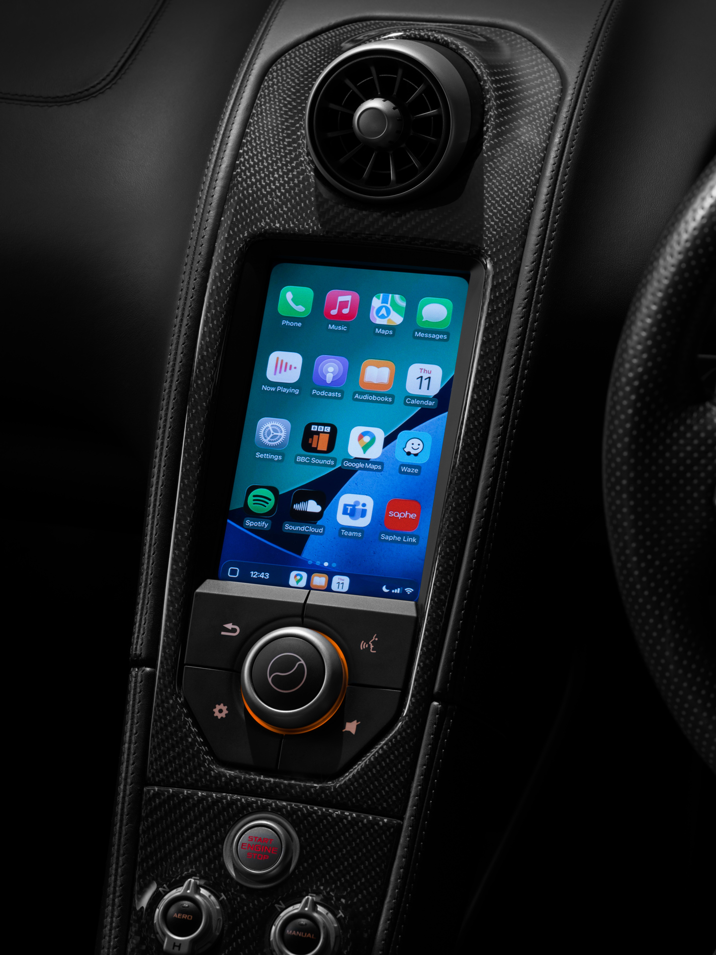 Apple CarPlay screen shown within the centre console of a McLaren Supercar.