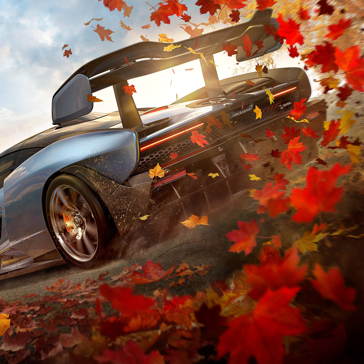 Shot taken from game of McLaren Senna taking off - wheel spin is causing leaves to rise into the air behind it.